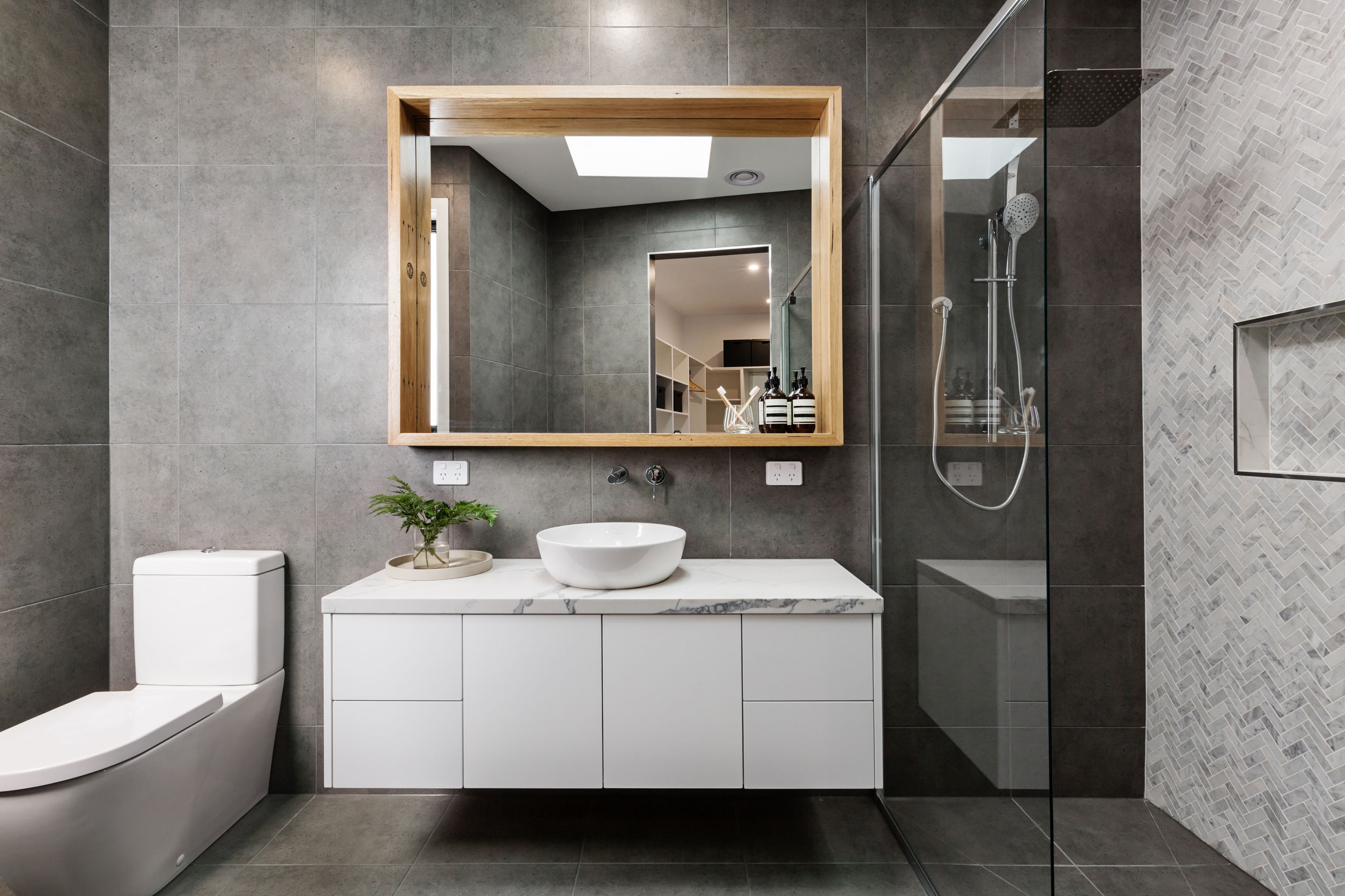 Read more about the article A Bathroom Upgrade with Glass and Mirror